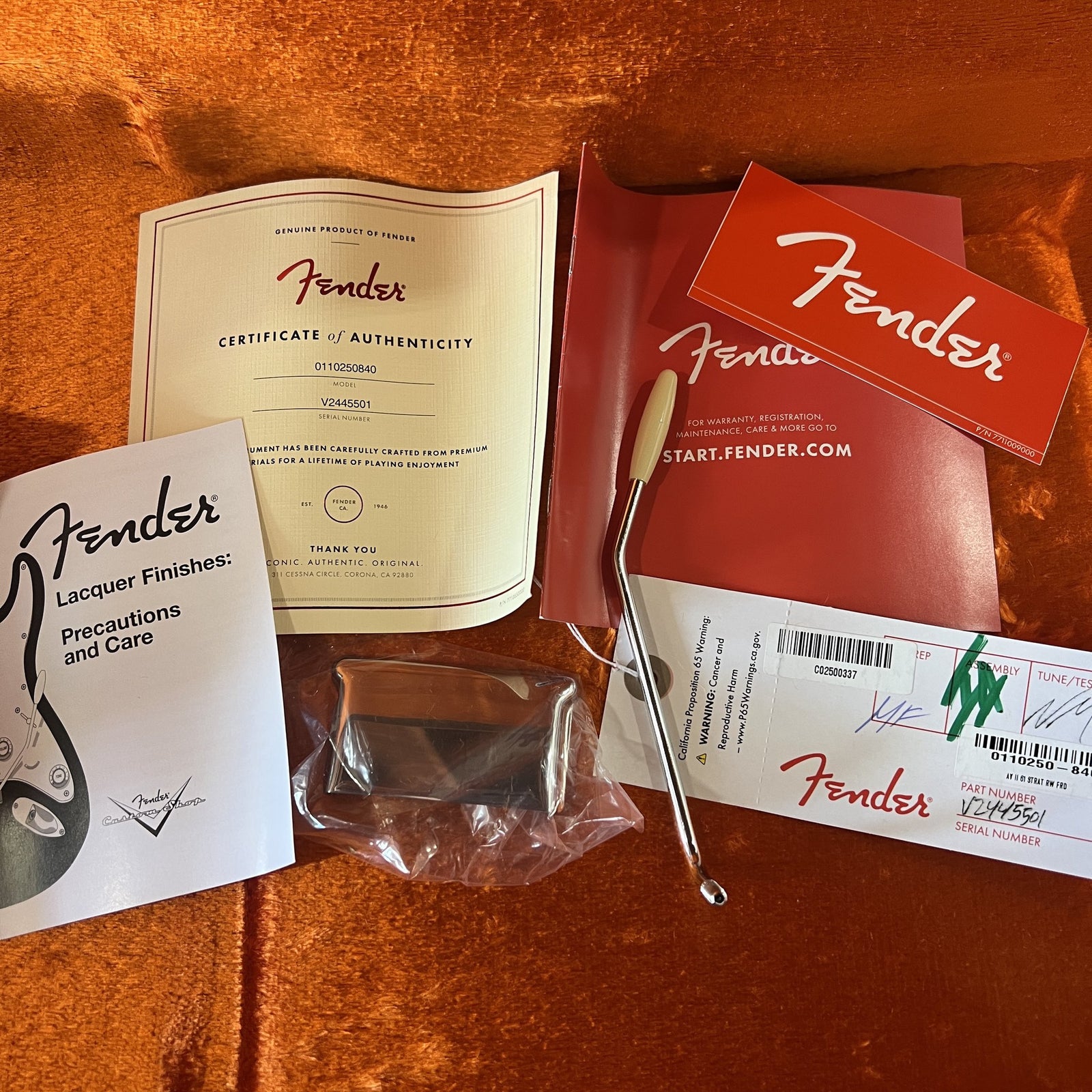 Original Fender hardshell case and included case candy for the 1961 American Vintage II Stratocaster