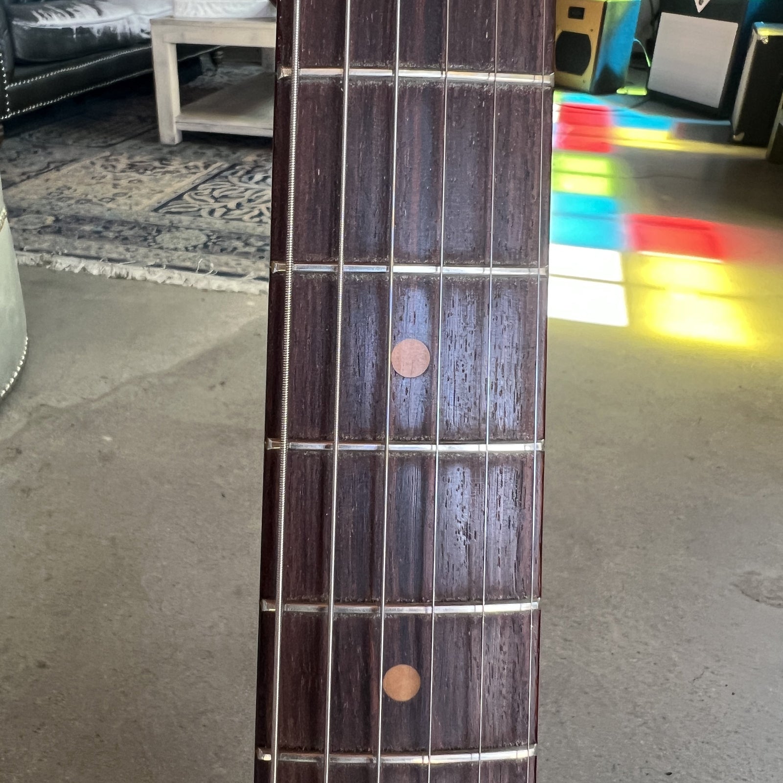 Close up of the slab rosewood fingerboard with clay dot inlays on the 1961 Stratocaster neck