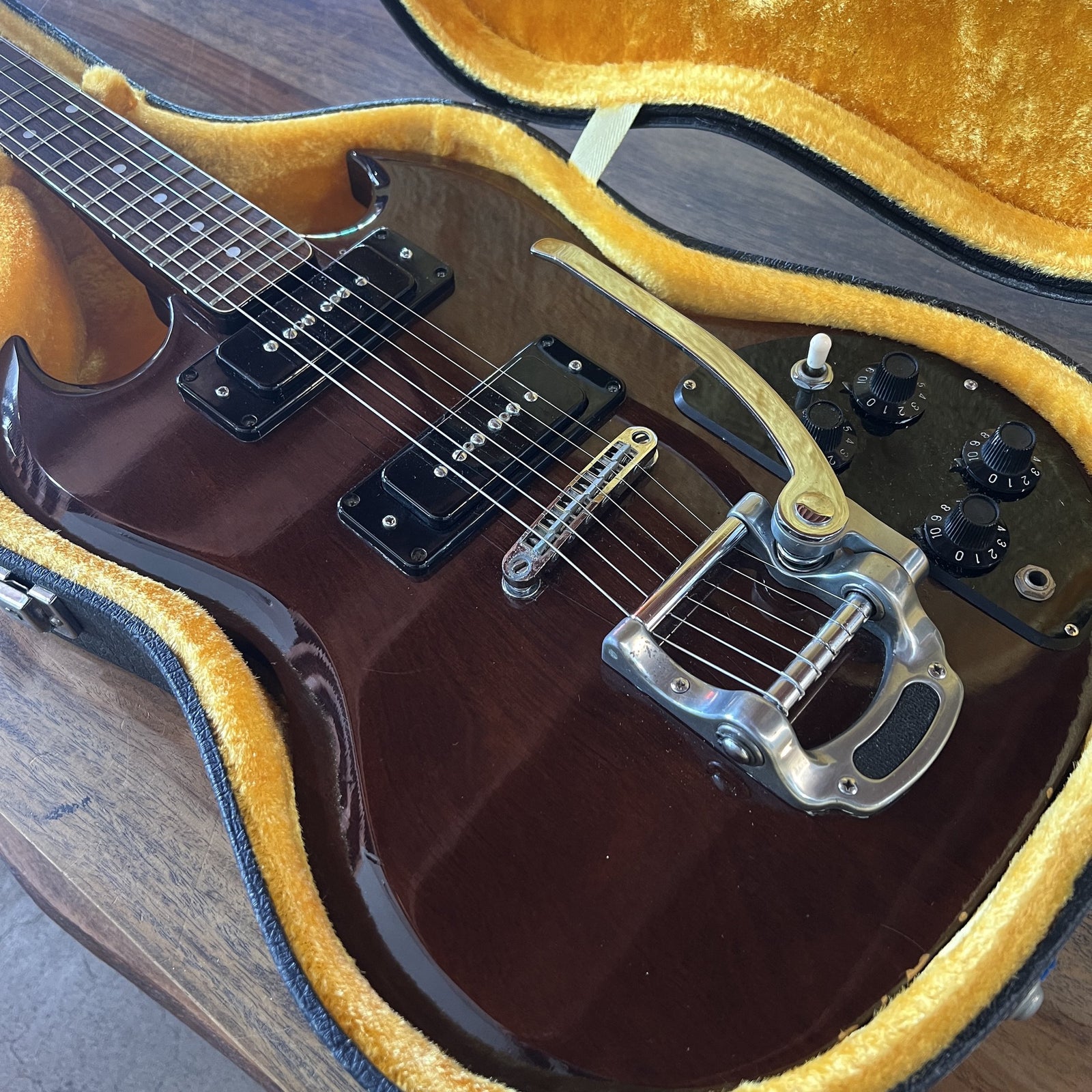 Vintage 1970s Ibanez SG Special electric guitar in Cherry finish resting in its yellow-lined hardshell case