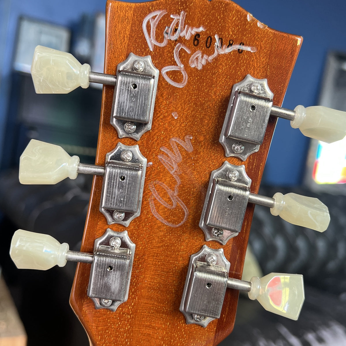 Back of headstock of 2006 Gibson Les Paul R7 Goldtop showing signatures of Richie Sambora and Orianthi with serial number R7 60086.