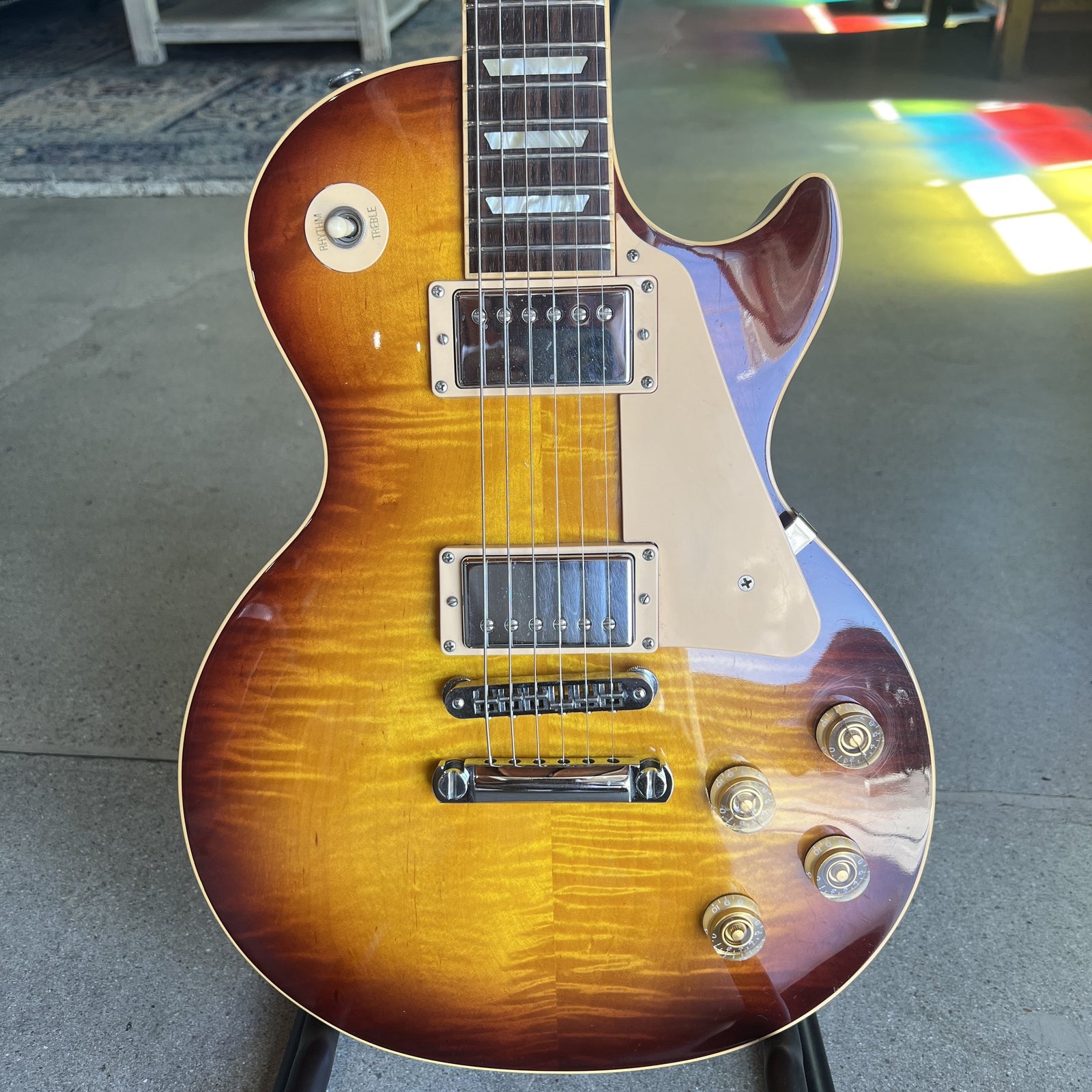 2009 Gibson Les Paul Traditional electric guitar with figured flamed maple top and burst finish.