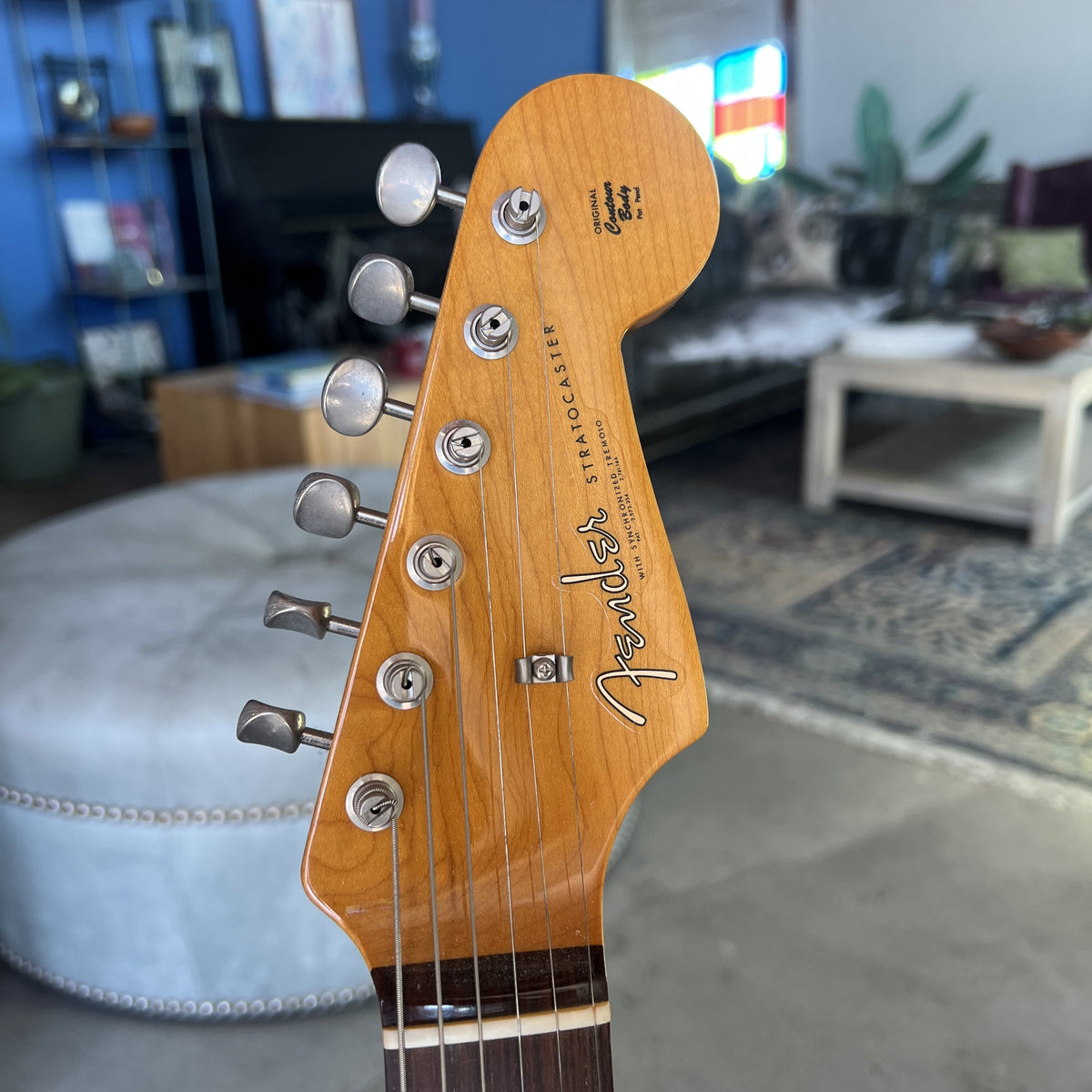 Headstock and pure vintage single-line Fender Deluxe tuners on the American Vintage II Stratocaster