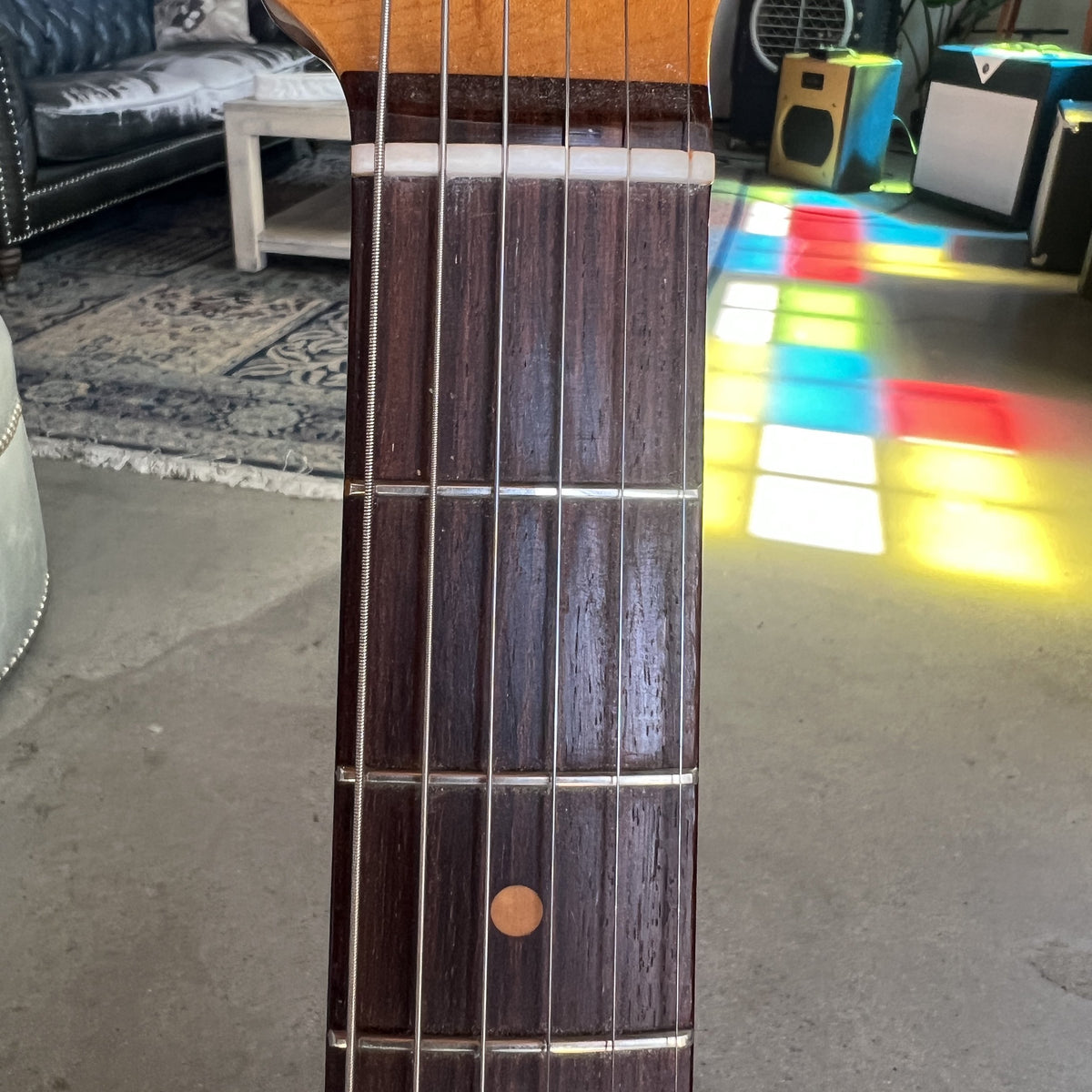 Close up of the slab rosewood fingerboard with clay dot inlays on the 1961 Stratocaster neck